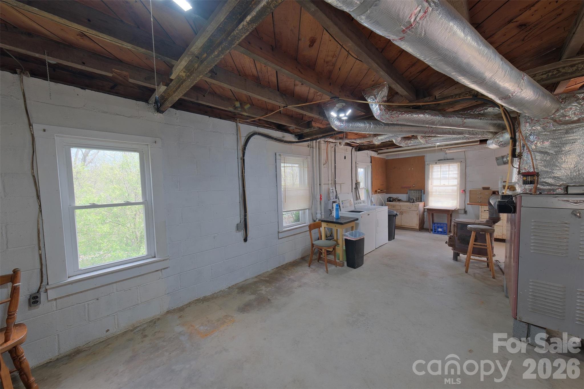 166 Spruce Street Canton, NC 28716 - Photo 16 of 23 a view of livingroom with furniture and window