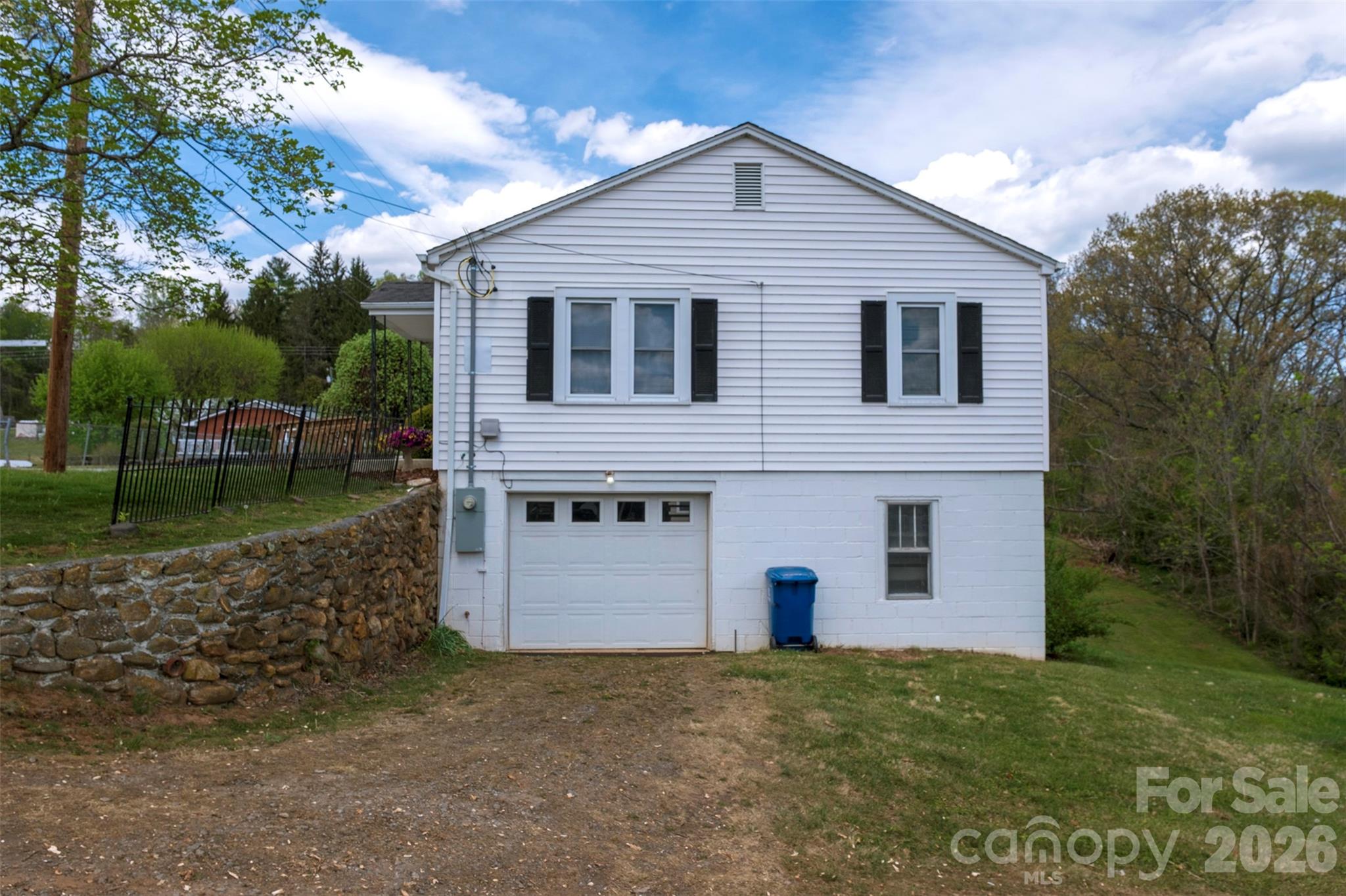166 Spruce Street Canton, NC 28716 - Photo 18 of 23 a front view of a house with a garden