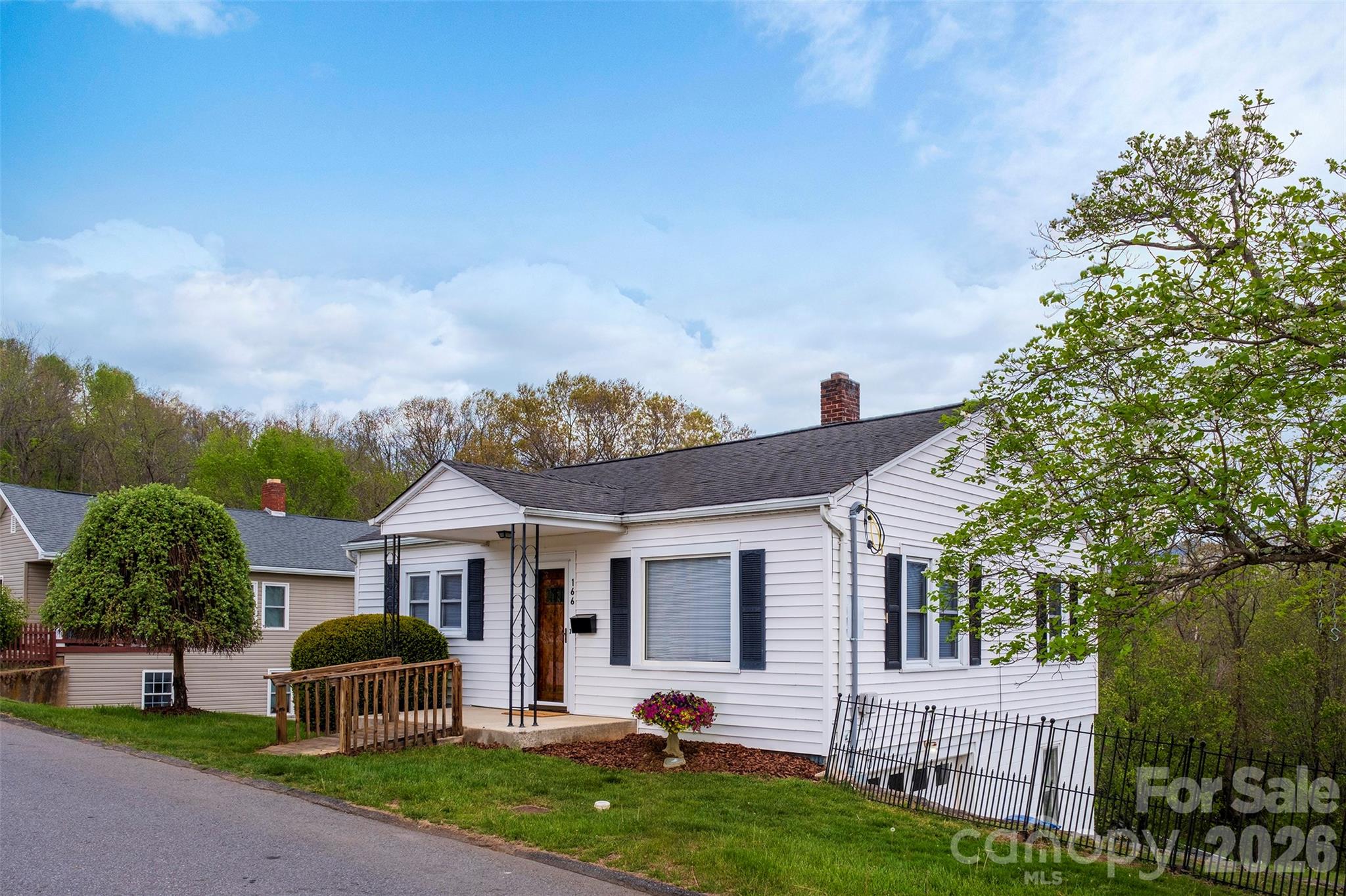166 Spruce Street Canton, NC 28716 - Photo 2 of 23 a front view of a house with garden