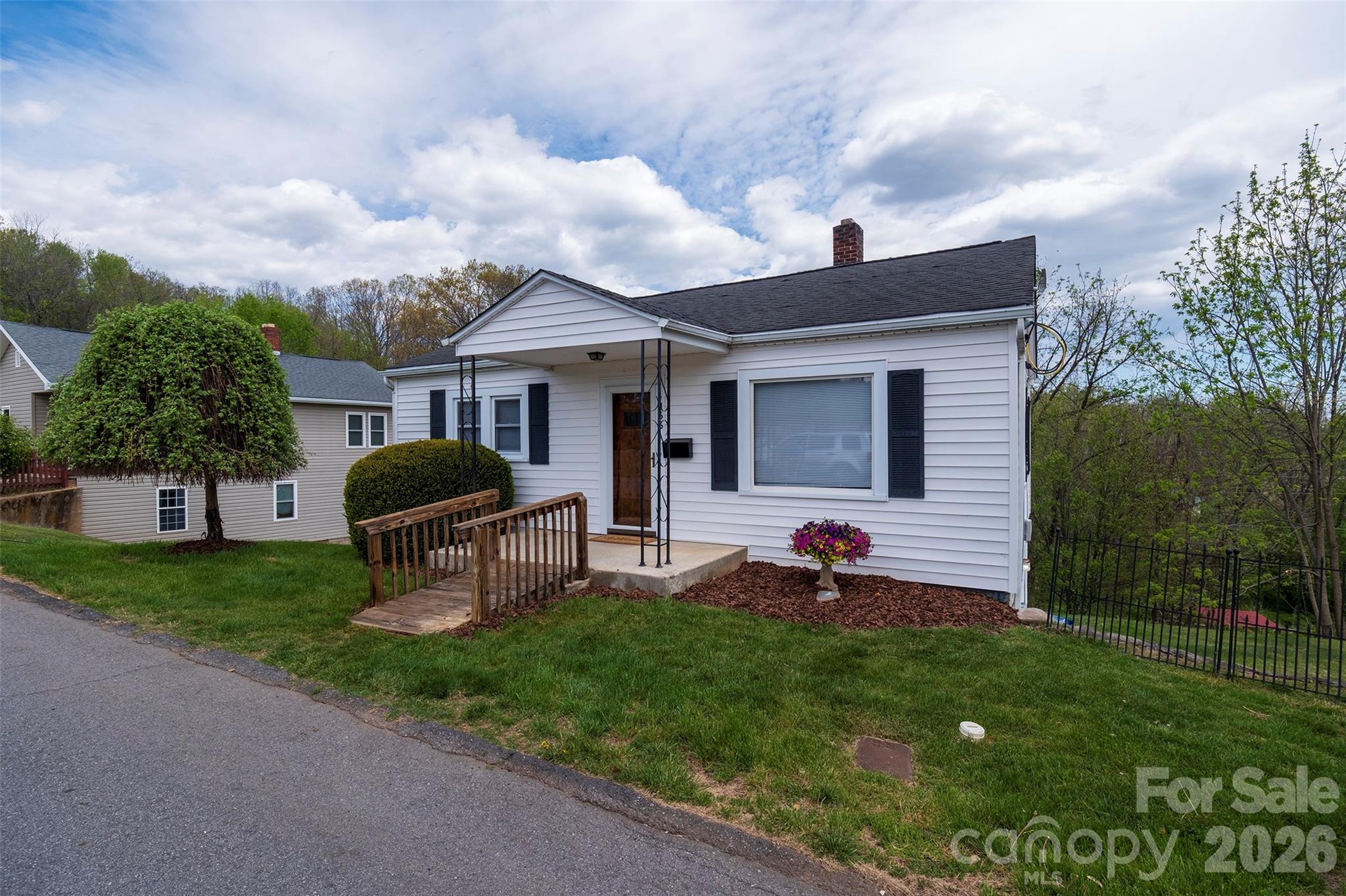 166 Spruce Street Canton, NC 28716 - Photo 4 of 23 a front view of a house with garden