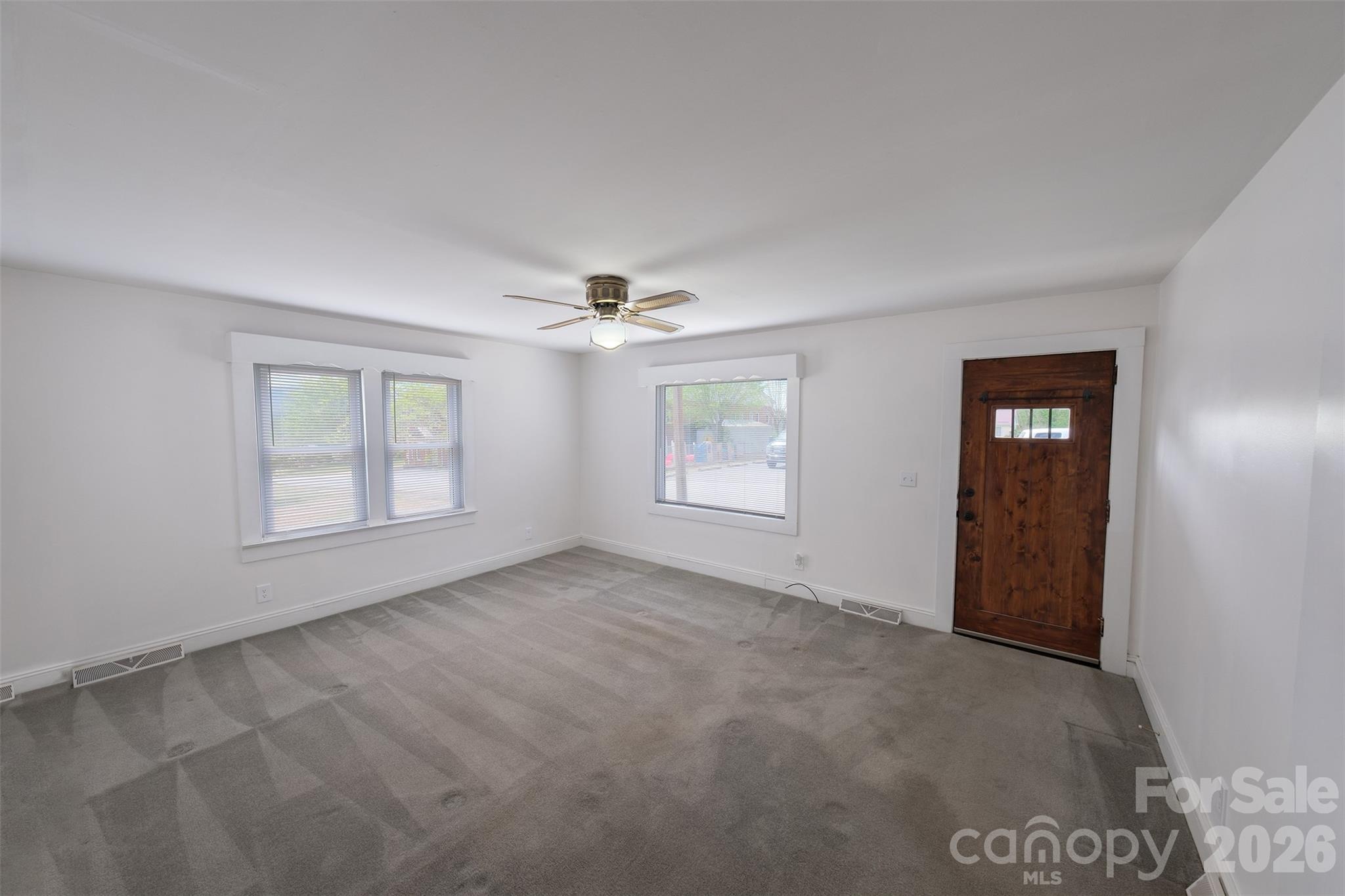 166 Spruce Street Canton, NC 28716 - Photo 5 of 23 an empty room with windows and closet