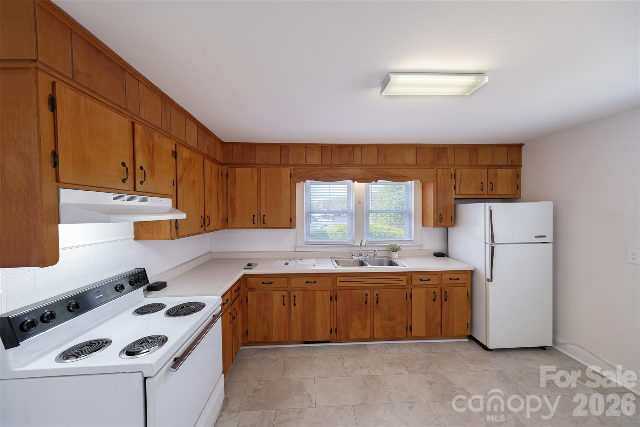 166 Spruce Street Canton, NC 28716 - Photo 8 of 23 a kitchen that has a sink and a stove