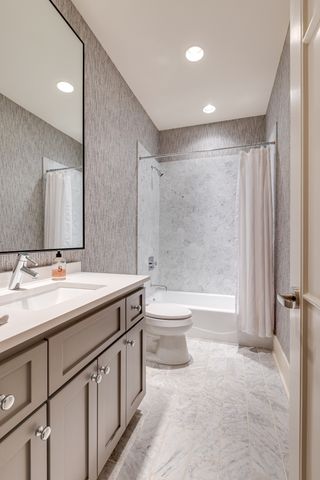 a utility room with sink dryer and washer