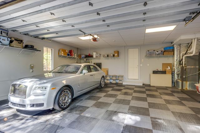a kitchen with sink stove and refrigerator
