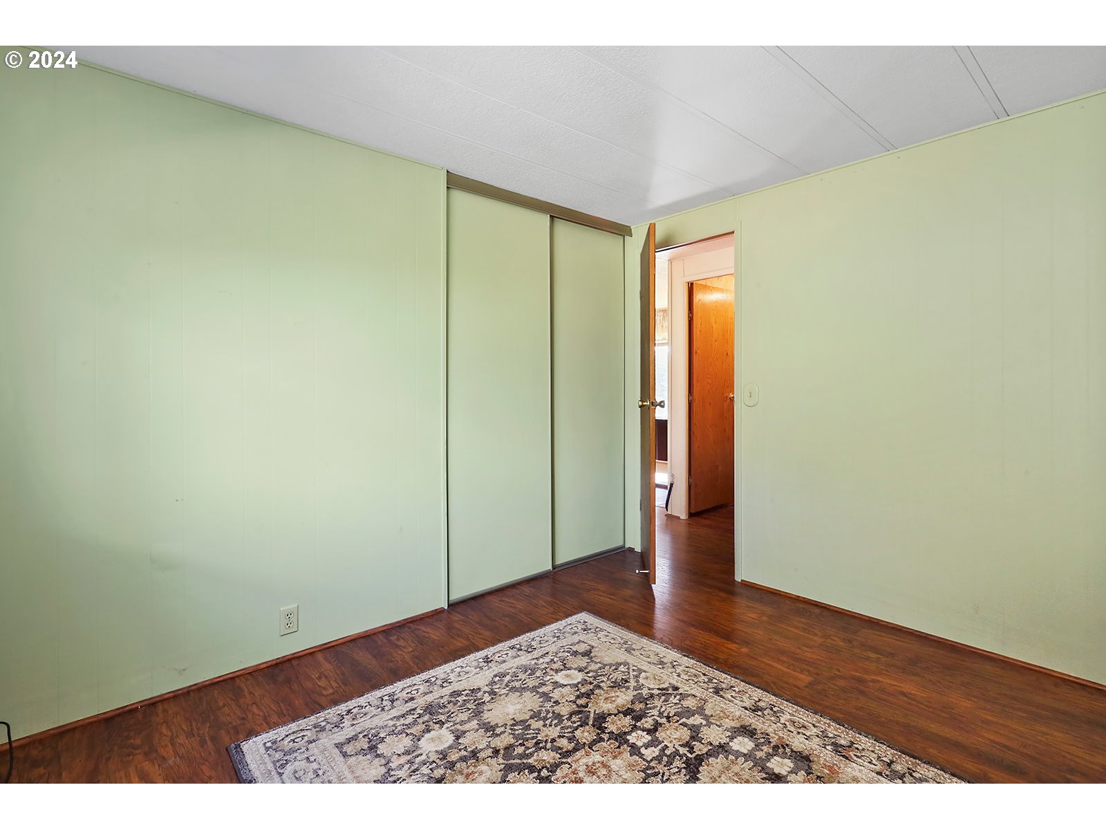 42 George Road Underwood, WA 98651 - Photo 18 of 45 a view of an empty room with wooden floor