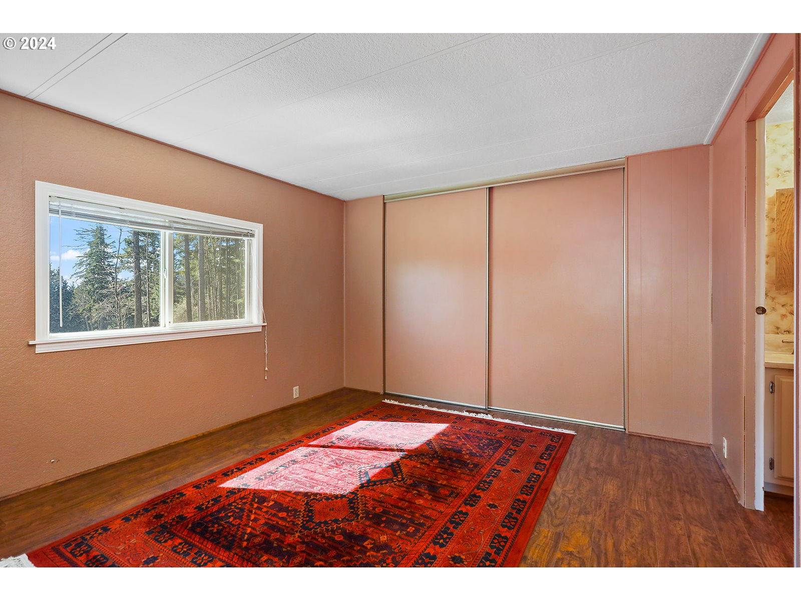 42 George Road Underwood, WA 98651 - Photo 21 of 45 a view of an empty room with window and hardwood floor