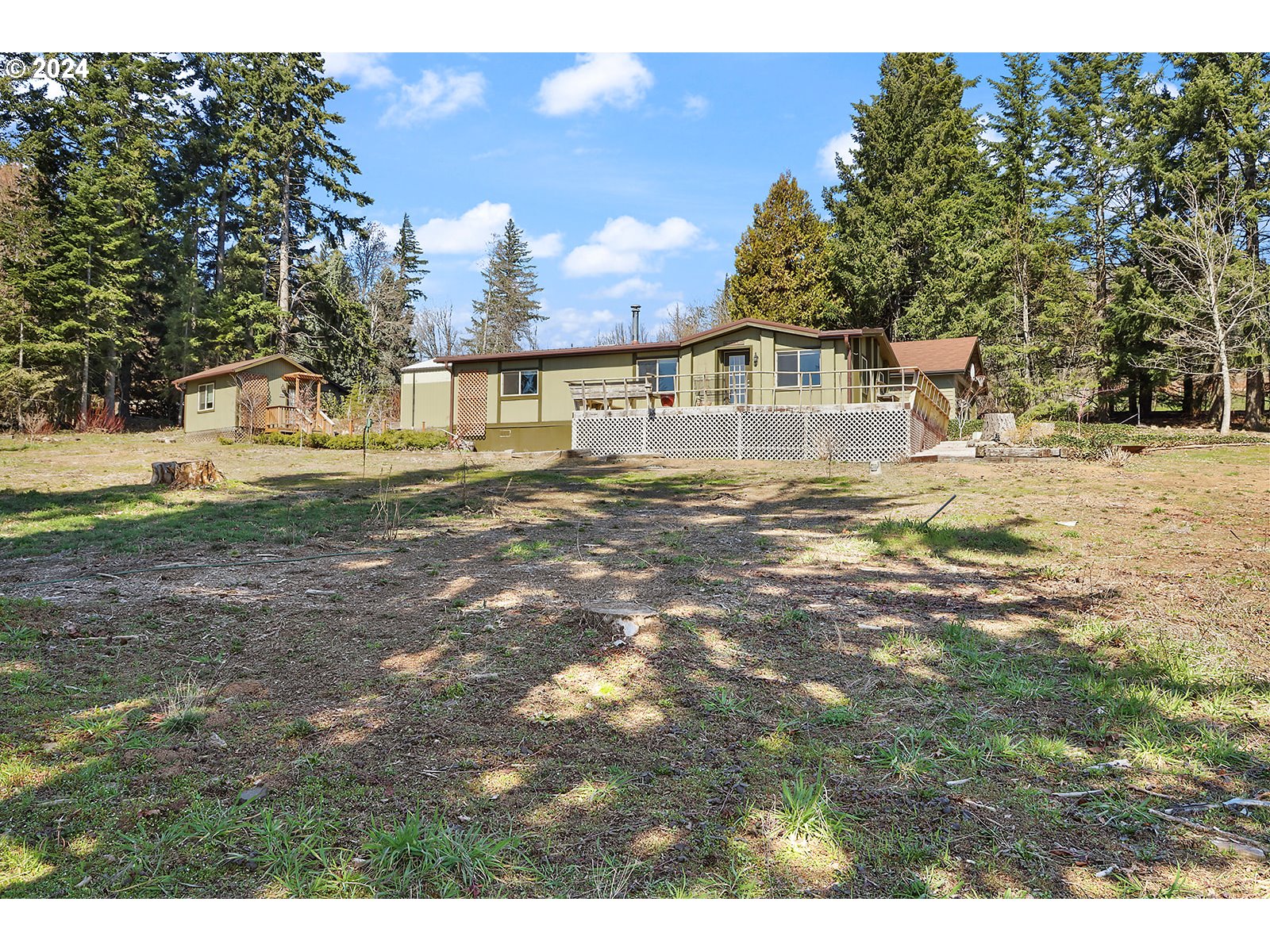 42 George Road Underwood, WA 98651 - Photo 36 of 45 a view of a yard in front of a house with a tree