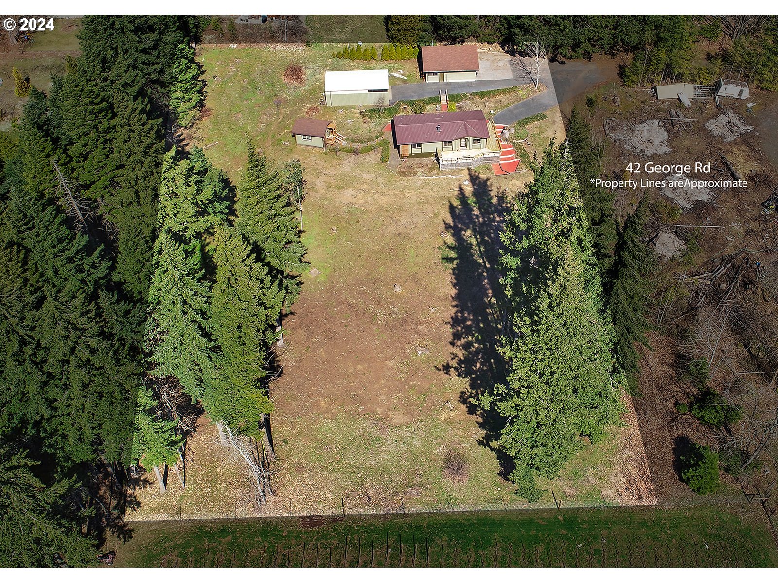 42 George Road Underwood, WA 98651 - Photo 45 of 45 an aerial view of a house with a yard and lake view
