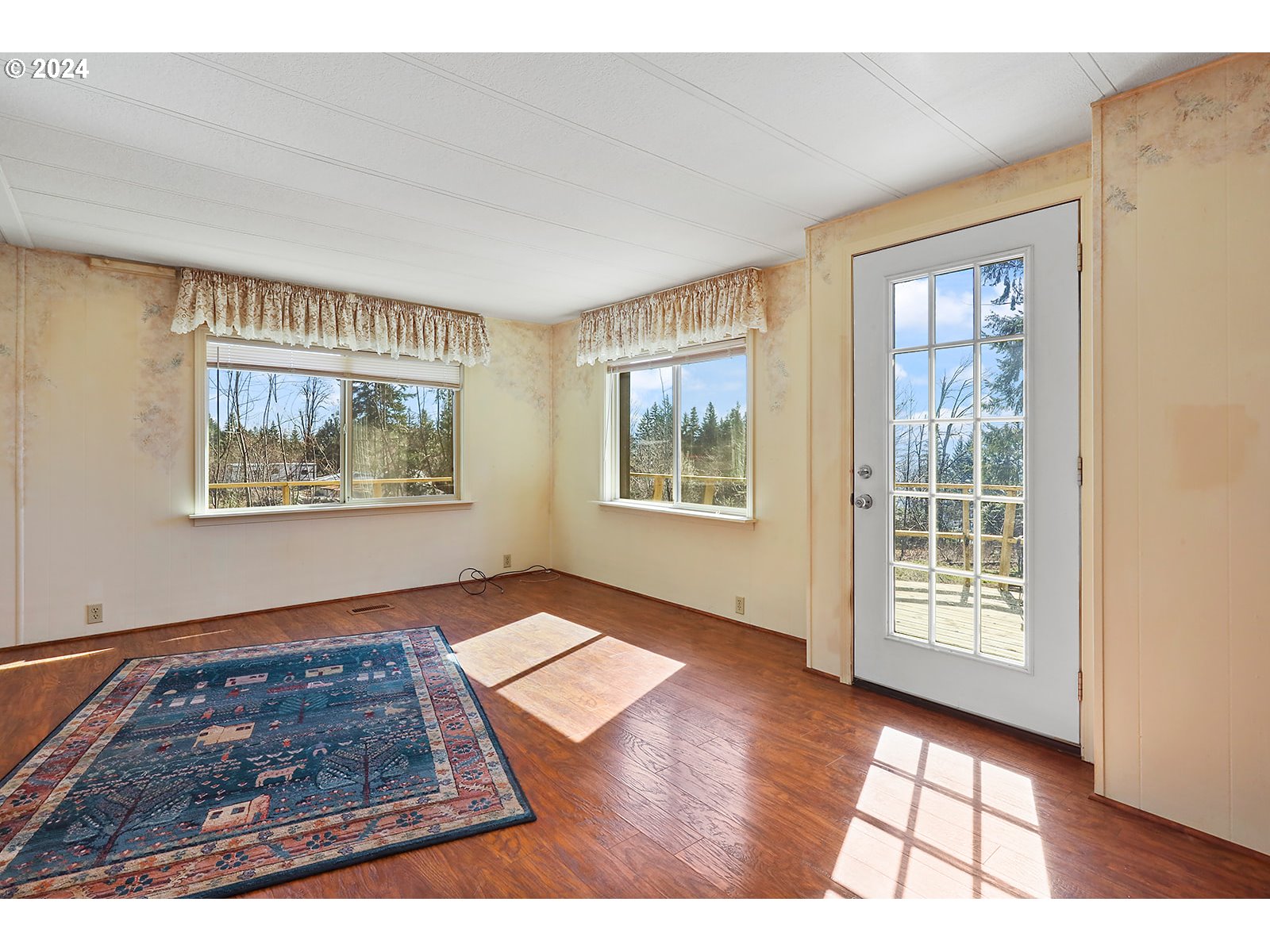 42 George Road Underwood, WA 98651 - Photo 10 of 45 a view of an empty room with window and wooden floor