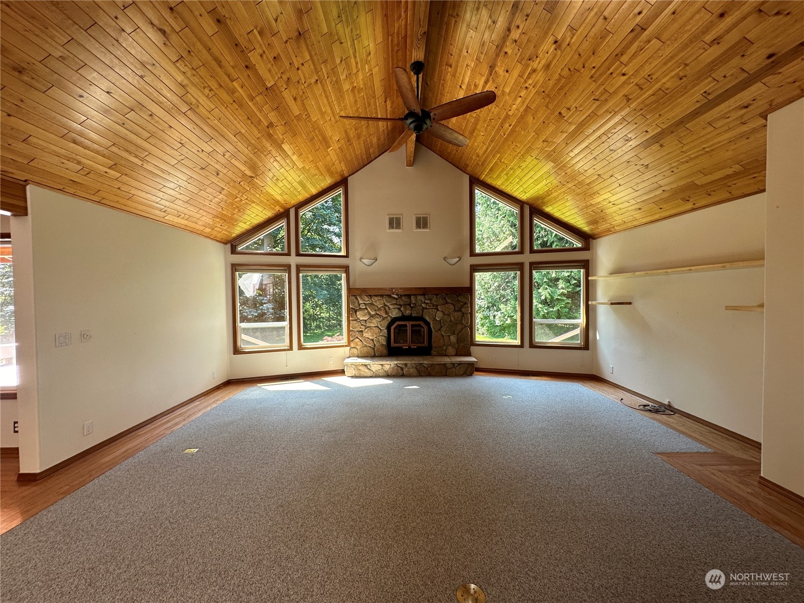 1893 Kelly Road Bellingham, WA 98226 - Photo 6 of 27 a view of a livingroom with an empty space and a fireplace
