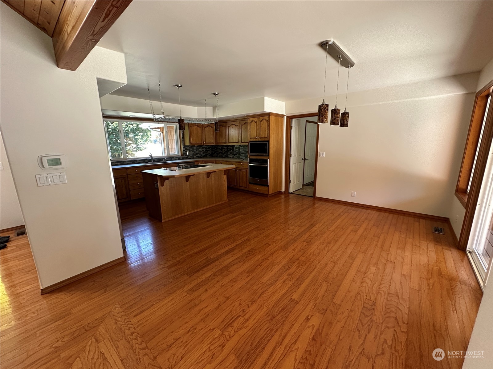 1893 Kelly Road Bellingham, WA 98226 - Photo 8 of 27 a kitchen with stainless steel appliances wooden floor and a refrigerator