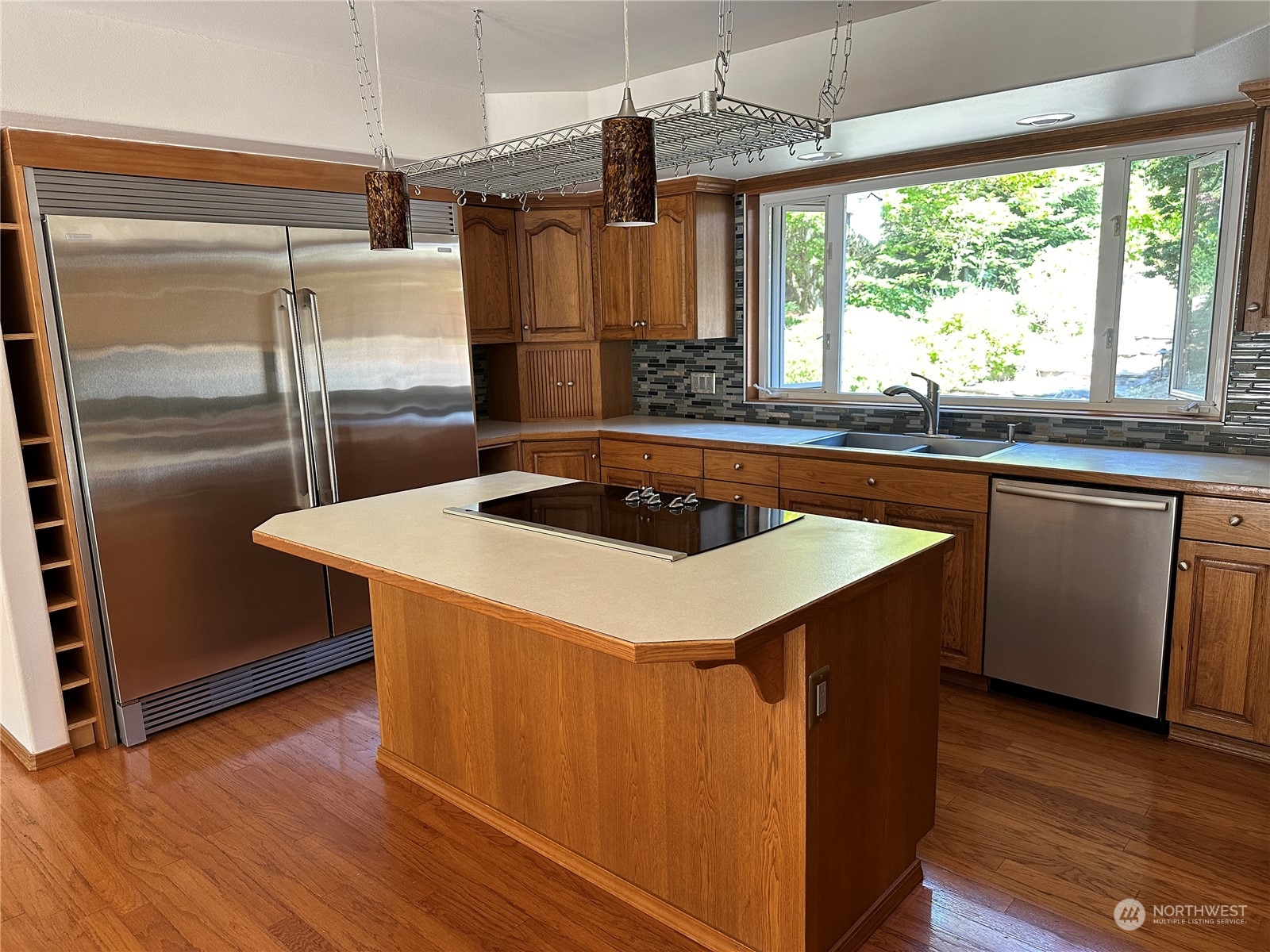1893 Kelly Road Bellingham, WA 98226 - Photo 9 of 27 a kitchen with stainless steel appliances a sink a counter space and a window