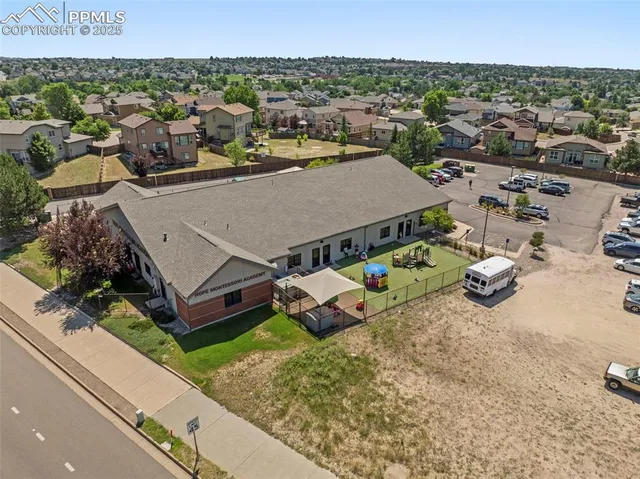 an aerial view of a house with a outdoor space