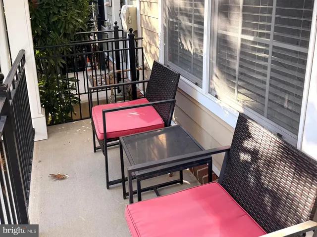 a view of a balcony with chairs