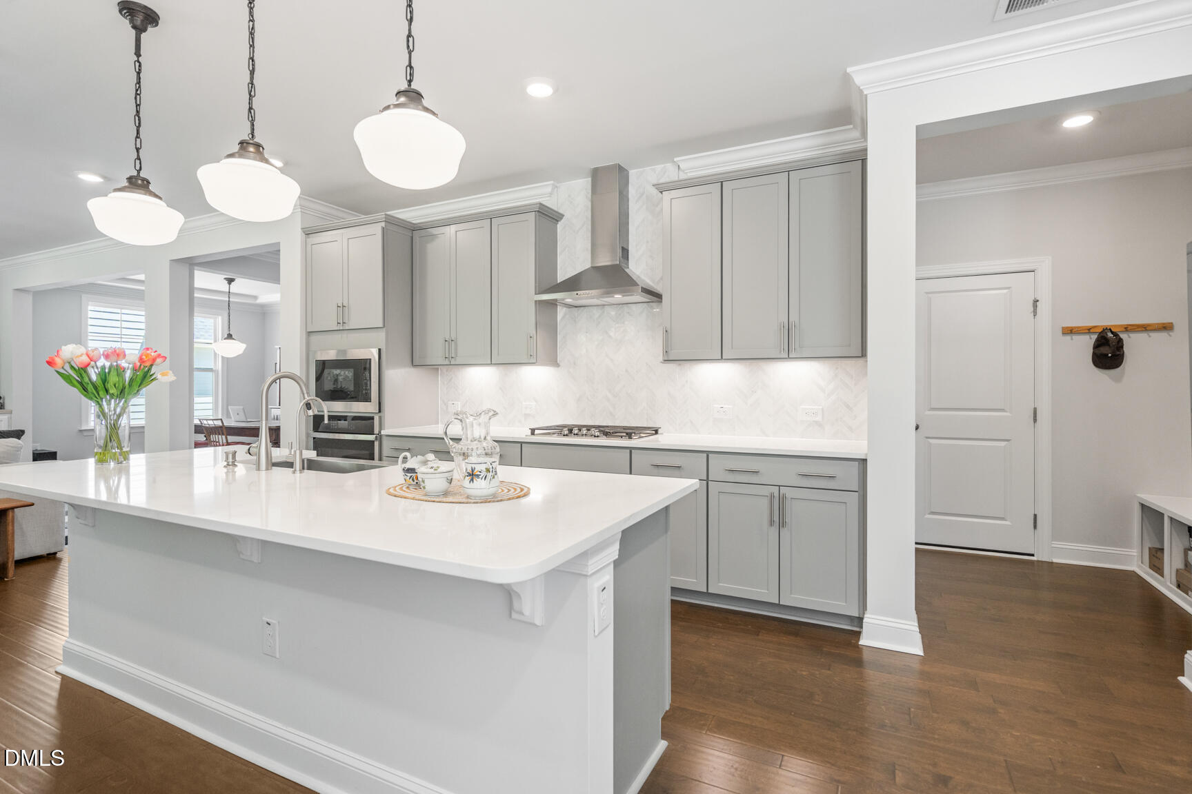 2966 Rise And Shine Road Apex, NC 27502 - Photo 21 of 61 a kitchen with stainless steel appliances a sink and a stove