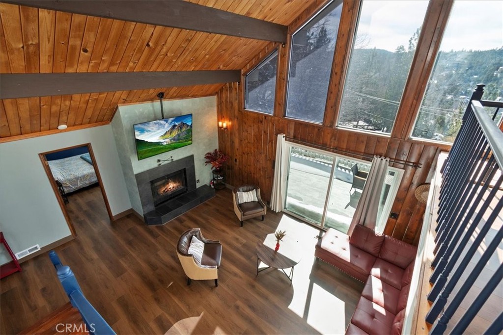27814 North Bay Road Lake Arrowhead, CA 92352 - Photo 24 of 68 a living room with furniture and a flat screen tv