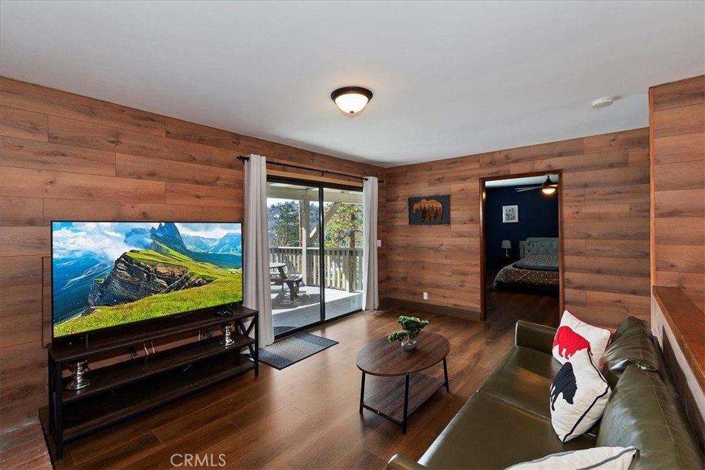 27814 North Bay Road Lake Arrowhead, CA 92352 - Photo 29 of 68 a living room with furniture and a flat screen tv