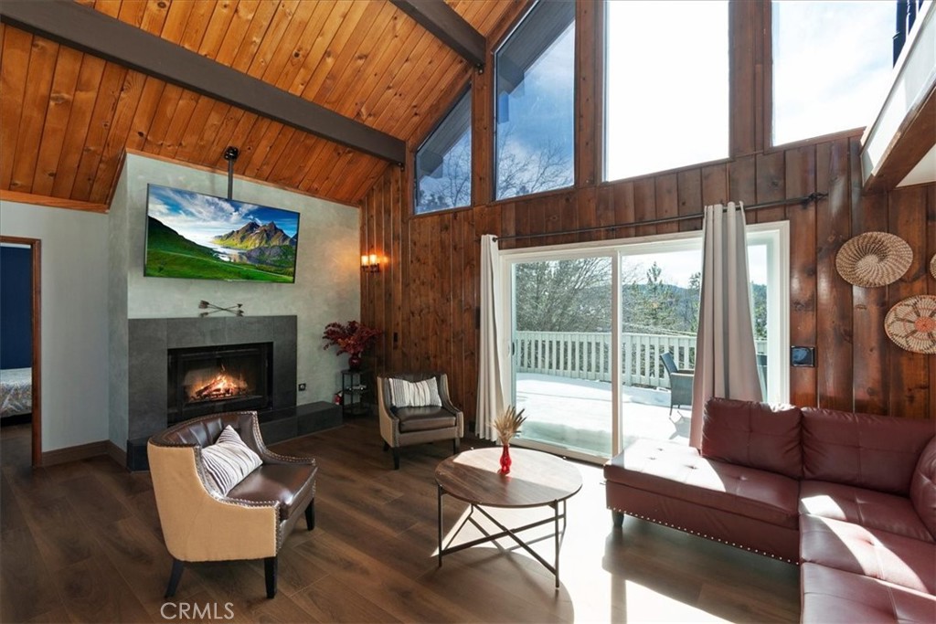 27814 North Bay Road Lake Arrowhead, CA 92352 - Photo 3 of 68 a living room with fireplace furniture and a flat screen tv