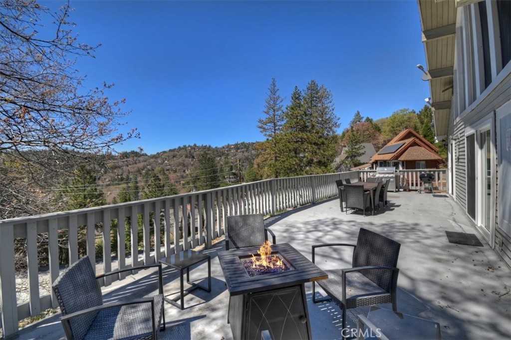 27814 North Bay Road Lake Arrowhead, CA 92352 - Photo 4 of 68 a view of a chairs and table on the terrace