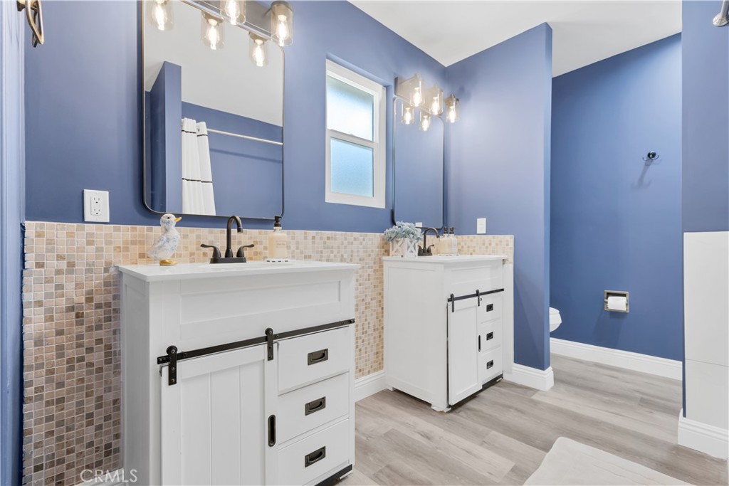 27814 North Bay Road Lake Arrowhead, CA 92352 - Photo 43 of 68 a bathroom with a double vanity sink mirror and