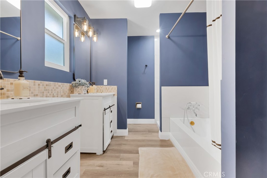 27814 North Bay Road Lake Arrowhead, CA 92352 - Photo 44 of 68 a bathroom with a sink vanity and mirror