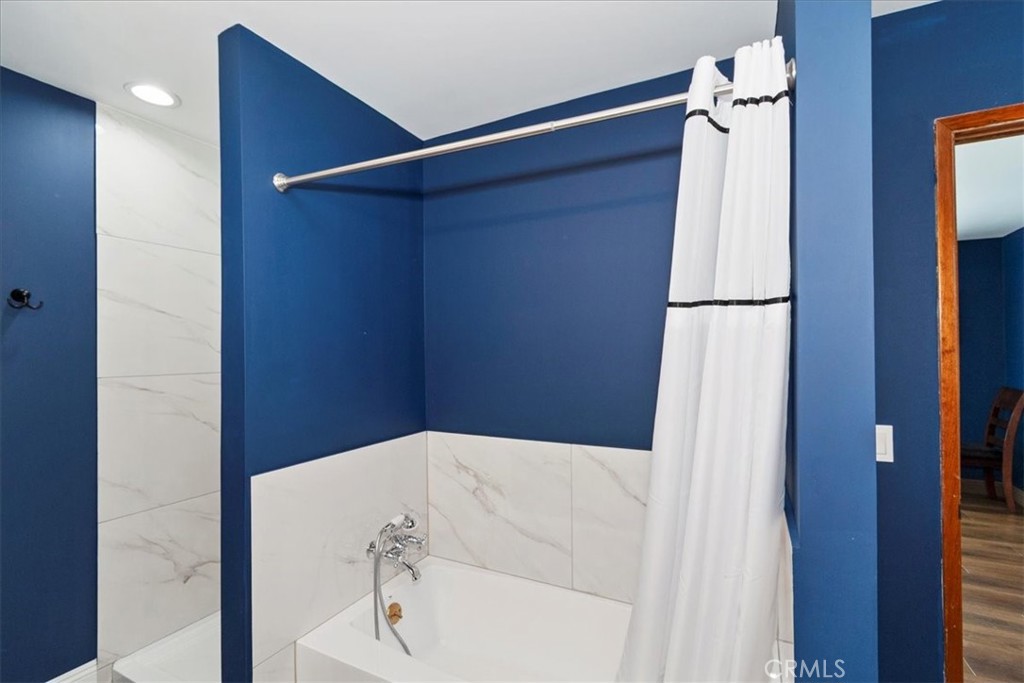 27814 North Bay Road Lake Arrowhead, CA 92352 - Photo 45 of 68 a bathroom with a bathtub and shower