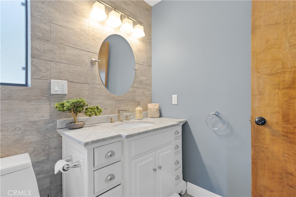 27814 North Bay Road Lake Arrowhead, CA 92352 - Photo 48 of 68 a bathroom with a sink and a mirror