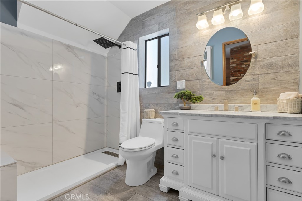 27814 North Bay Road Lake Arrowhead, CA 92352 - Photo 64 of 68 a bathroom with a sink and mirror
