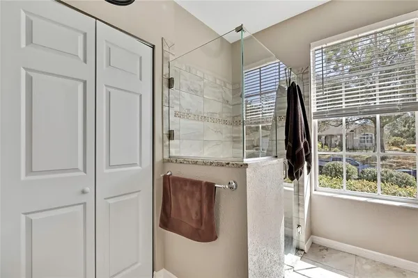a view of a patio with table and chairs and wooden floor