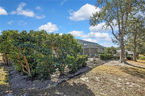 an aerial view of a house with a swimming pool