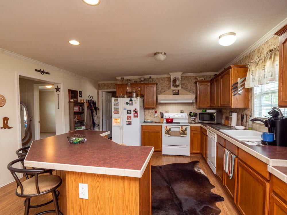 3676 Armstrong Road Springfield, TN 37172 - Photo 11 of 21 a kitchen with cabinets and chairs