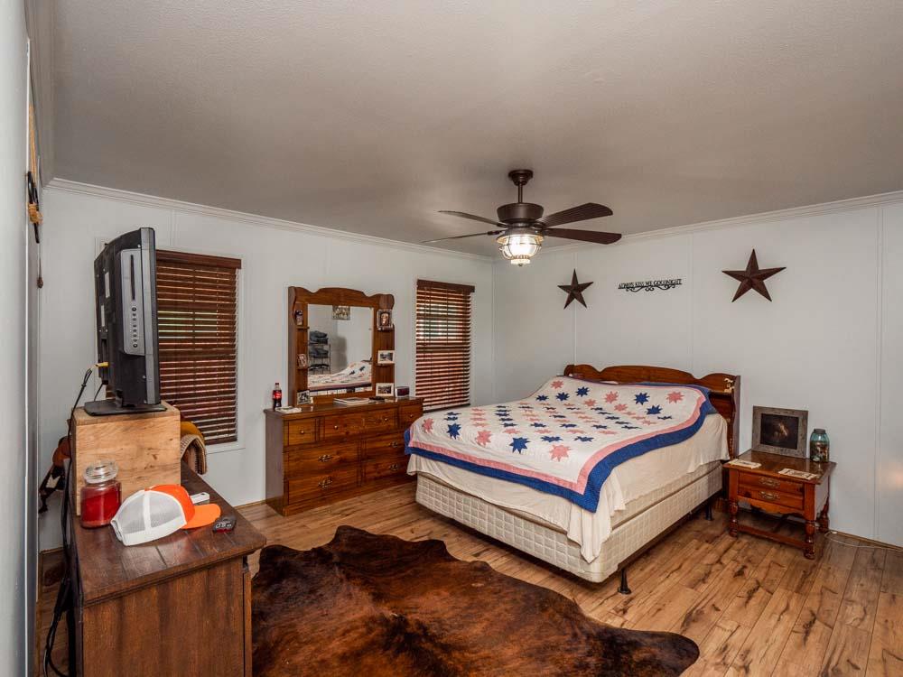3676 Armstrong Road Springfield, TN 37172 - Photo 14 of 21 a bedroom with a bed and wooden floor