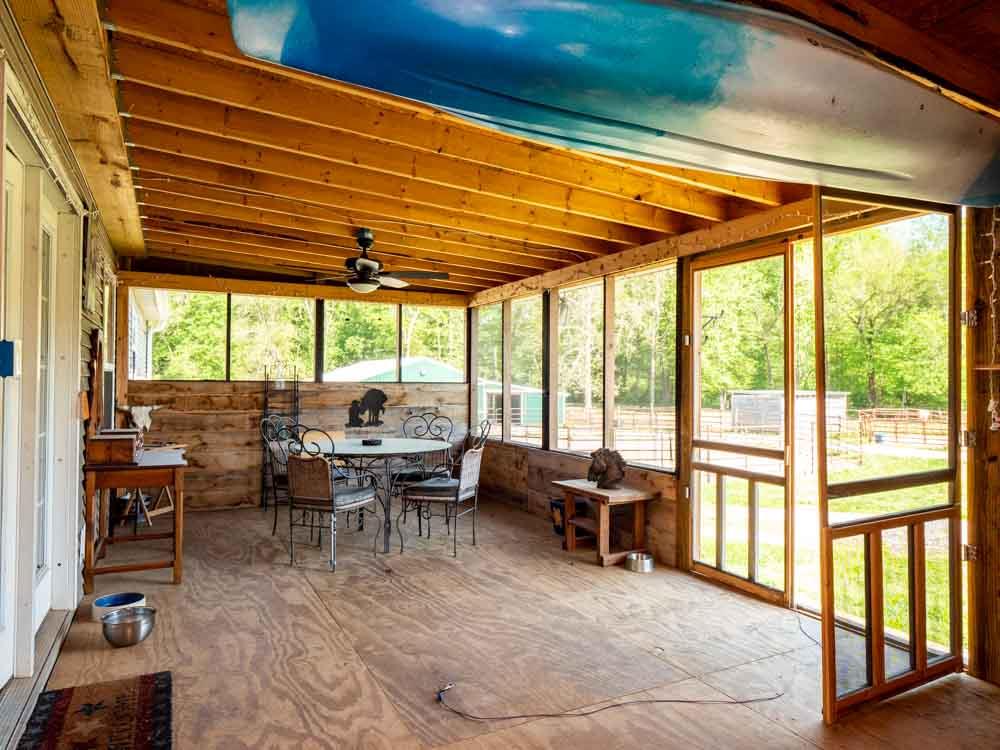 3676 Armstrong Road Springfield, TN 37172 - Photo 19 of 21 a view of a dining room with furniture large windows and wooden floor