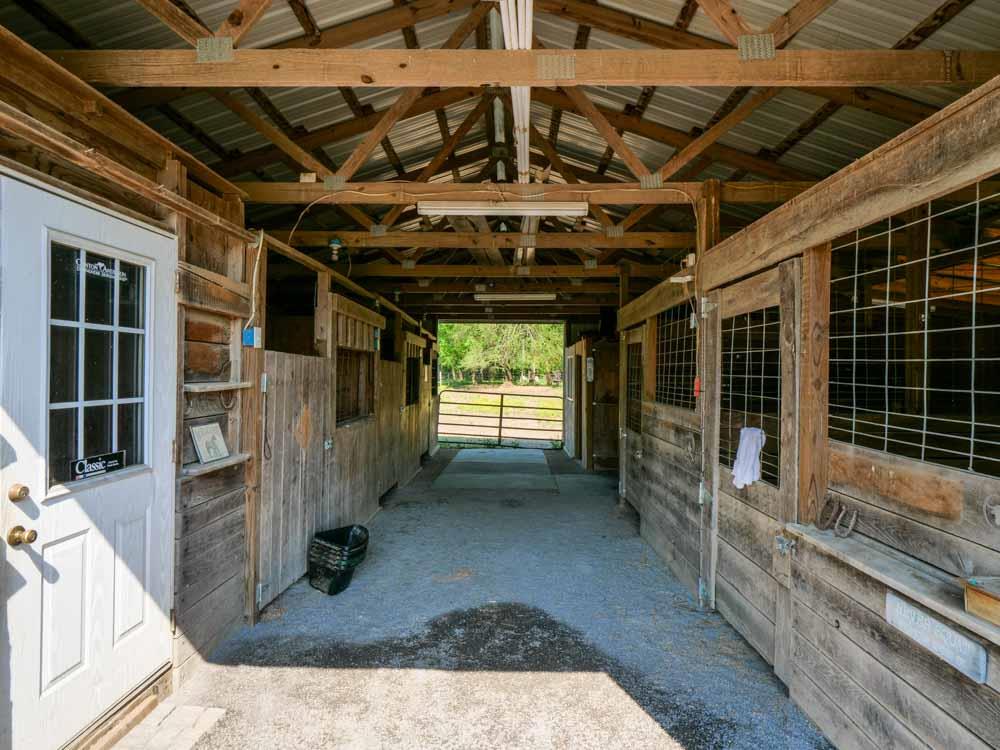3676 Armstrong Road Springfield, TN 37172 - Photo 6 of 21 a view of a porch with wooden floor and iron stairs