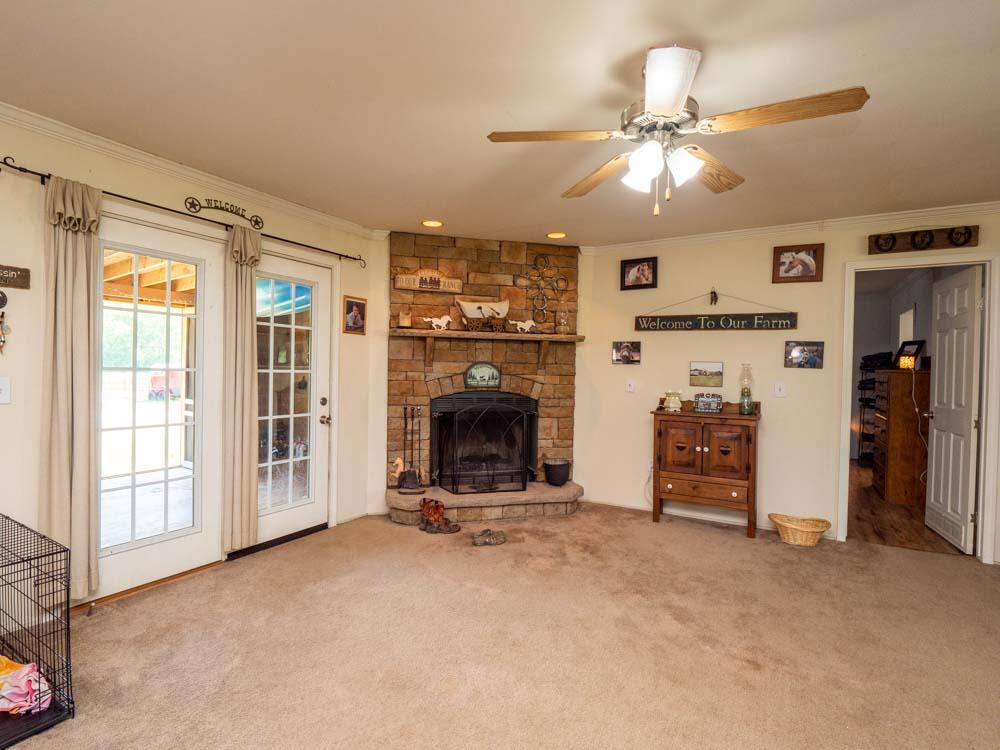3676 Armstrong Road Springfield, TN 37172 - Photo 9 of 21 a view of a livingroom with a fireplace and workspace