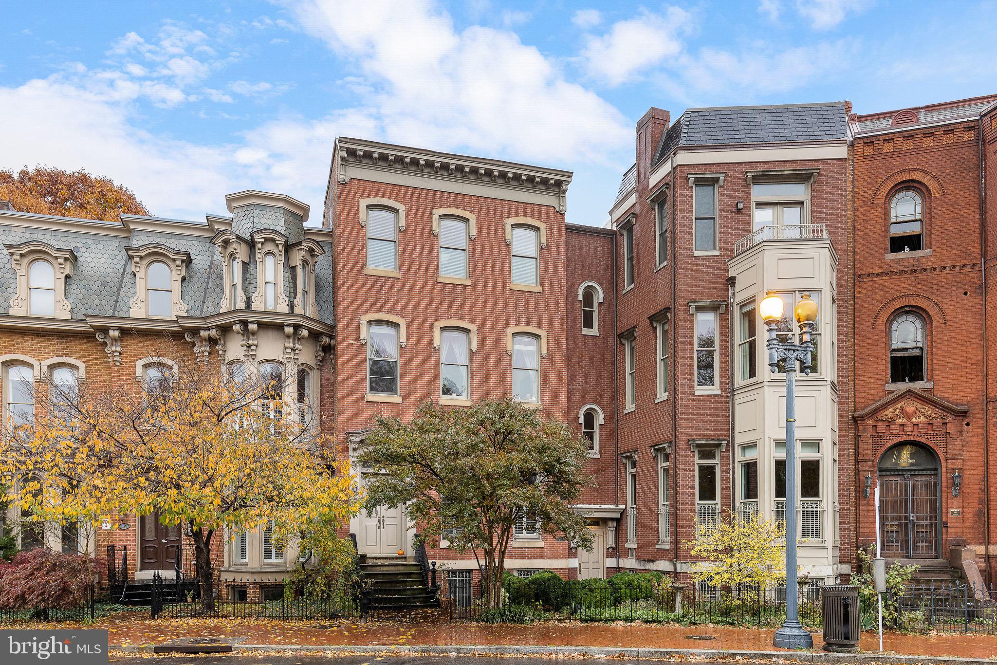 20 Logan Circle Northwest, Unit 33 Washington, DC 20005 - Photo 1 of 32 a front view of a residential apartment building with a yard