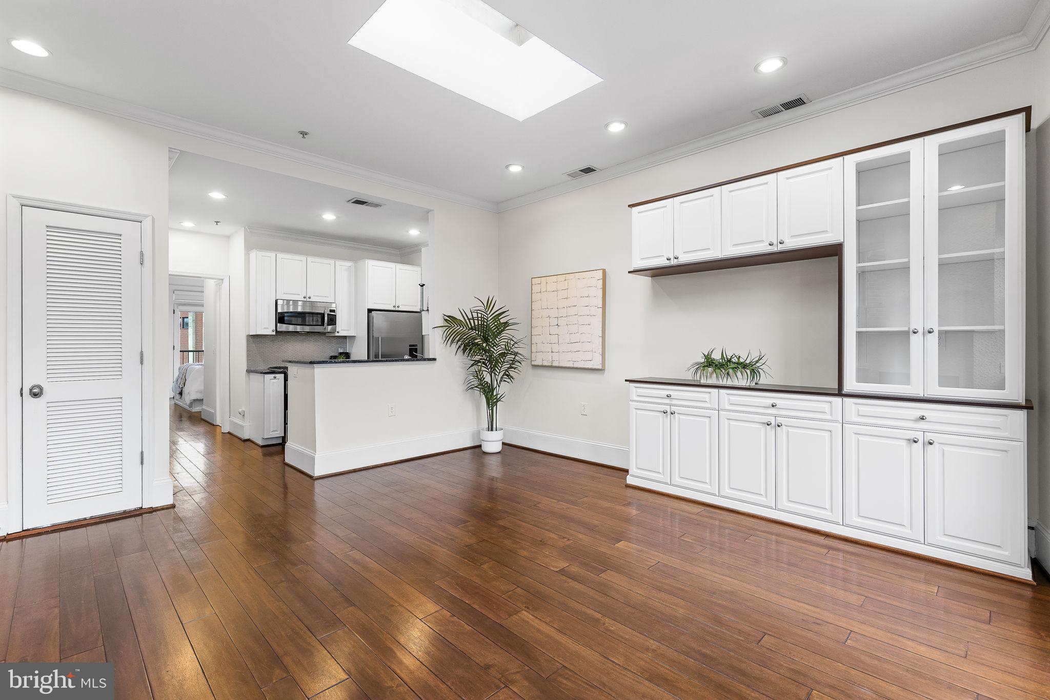 20 Logan Circle Northwest, Unit 33 Washington, DC 20005 - Photo 13 of 32 a view of a kitchen with furniture and wooden floor