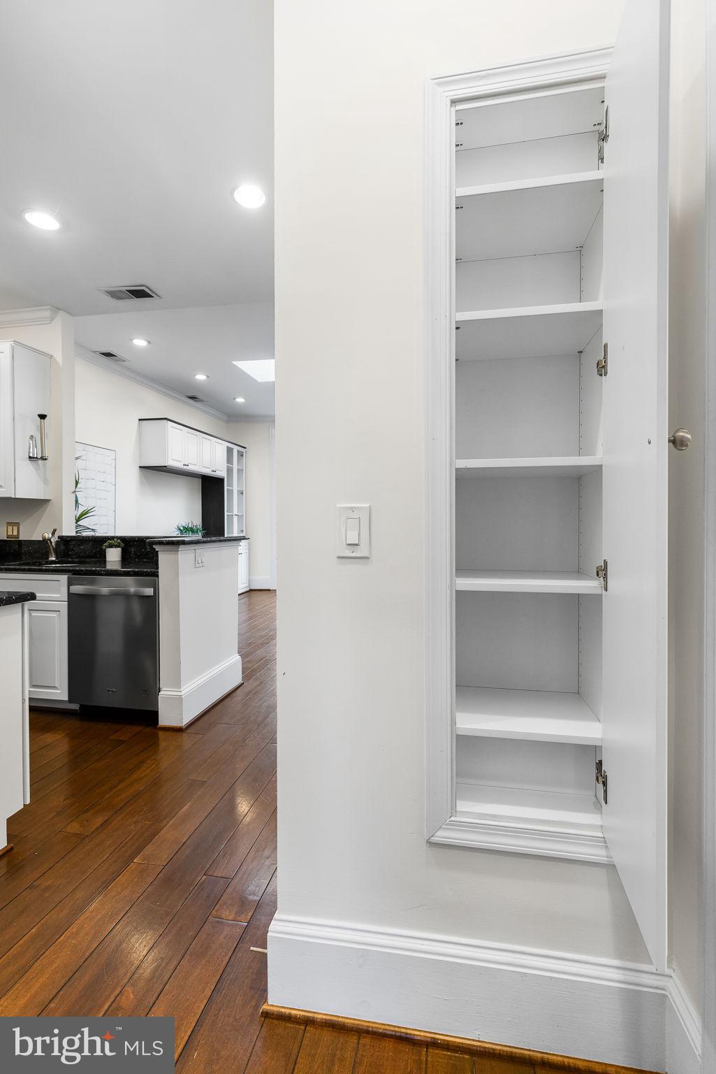 20 Logan Circle Northwest, Unit 33 Washington, DC 20005 - Photo 20 of 32 a view of kitchen with wooden floor and electronic appliances