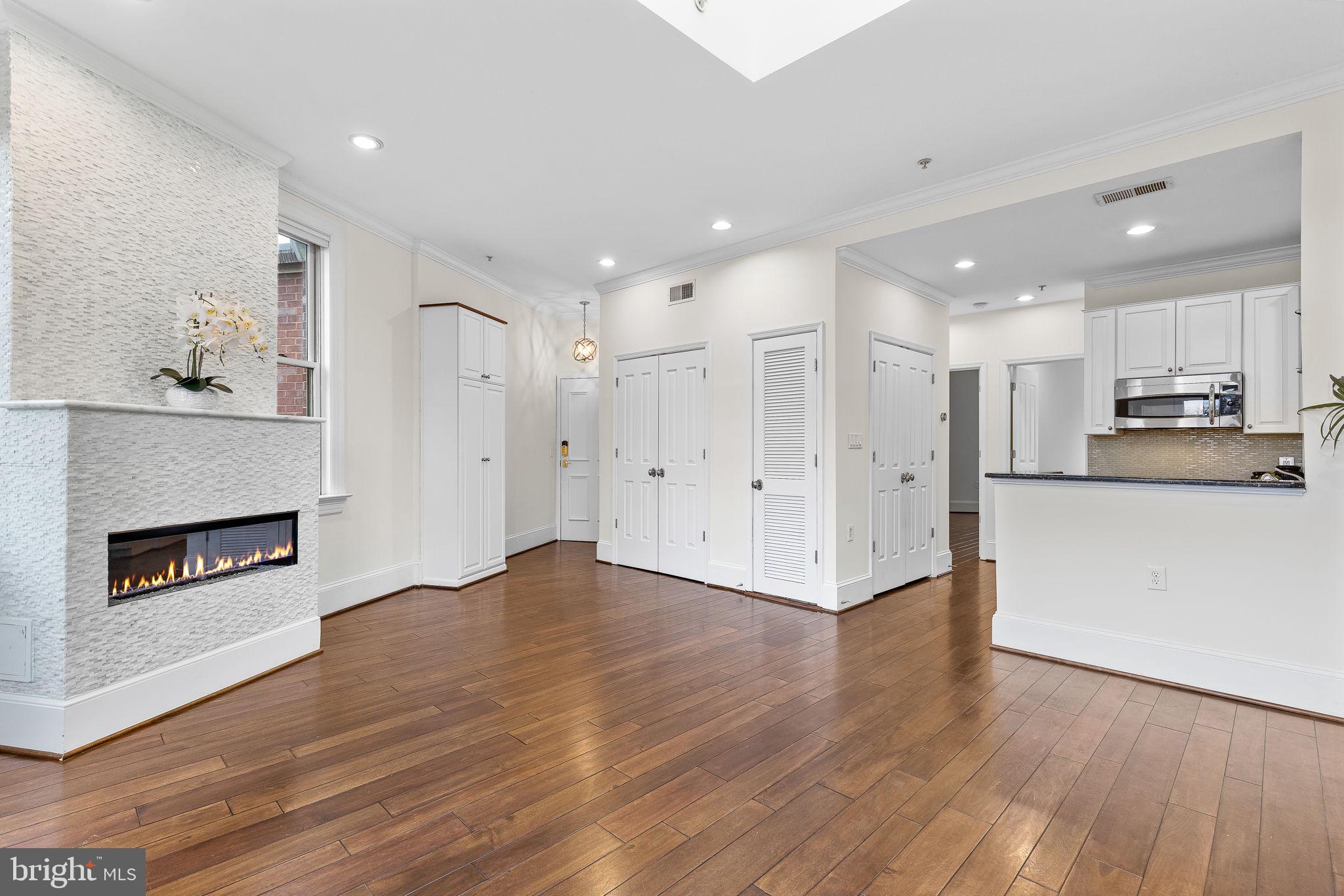 20 Logan Circle Northwest, Unit 33 Washington, DC 20005 - Photo 4 of 32 a view of a kitchen with wooden floor and a kitchen