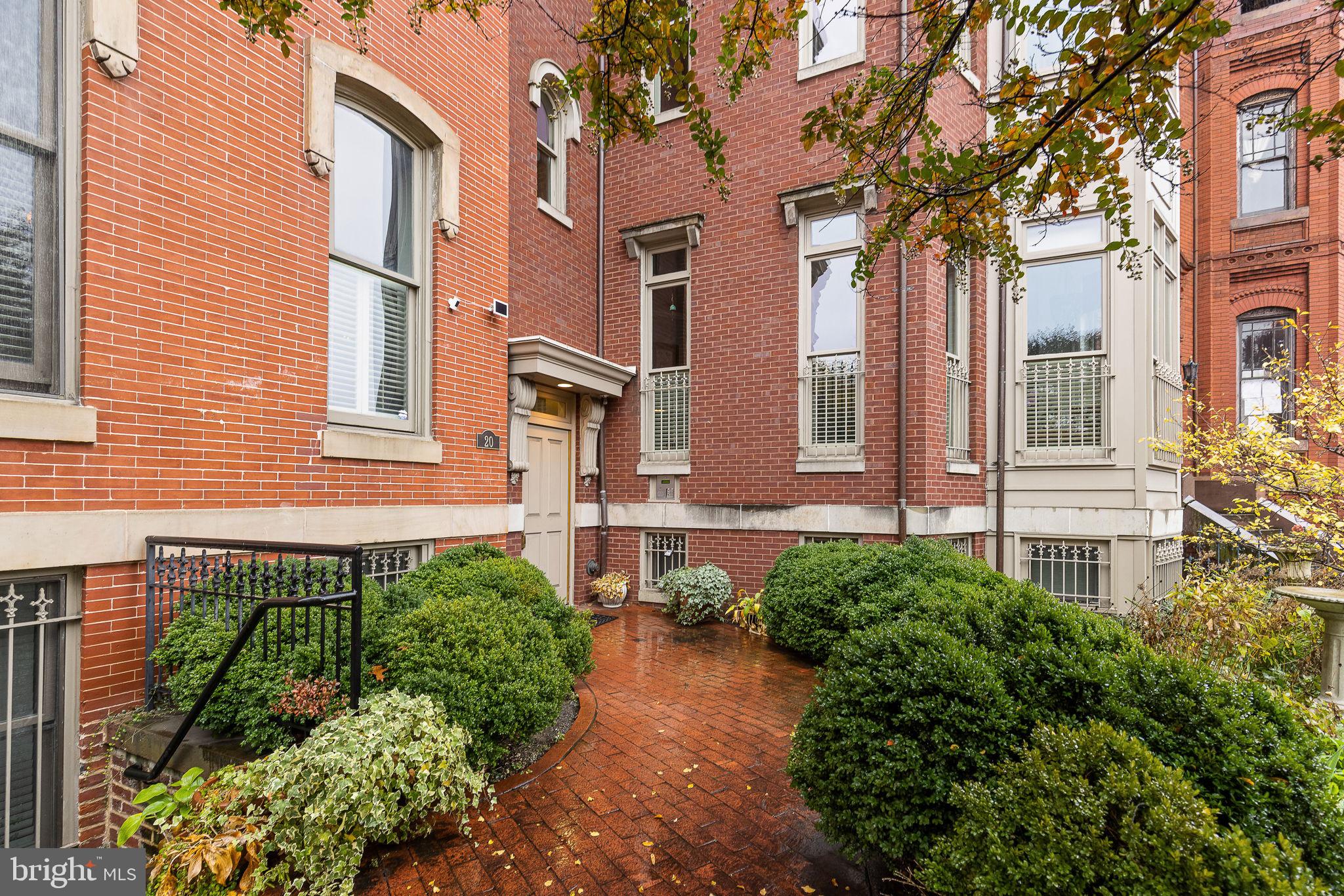 20 Logan Circle Northwest, Unit 33 Washington, DC 20005 - Photo 8 of 32 a view of a brick building next to a yard