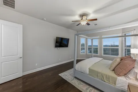 a living room with a bed furniture and a window