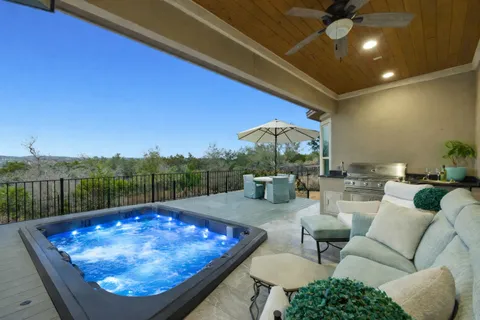 a living room with furniture and floor to ceiling window