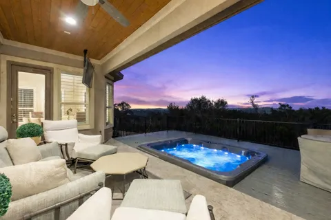 a view of a swimming pool with a patio