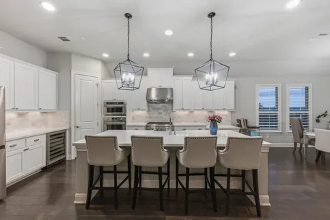 a living room with furniture fireplace and a table