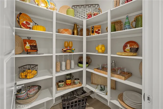 a view of a workspace with furniture and a potted plant