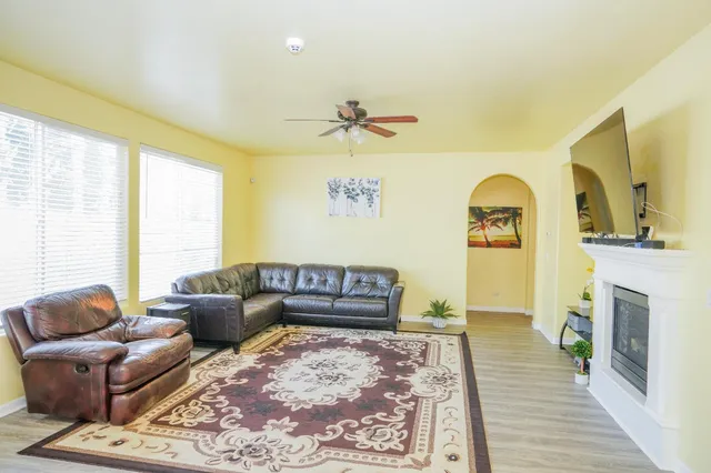 a living room with furniture and a fireplace