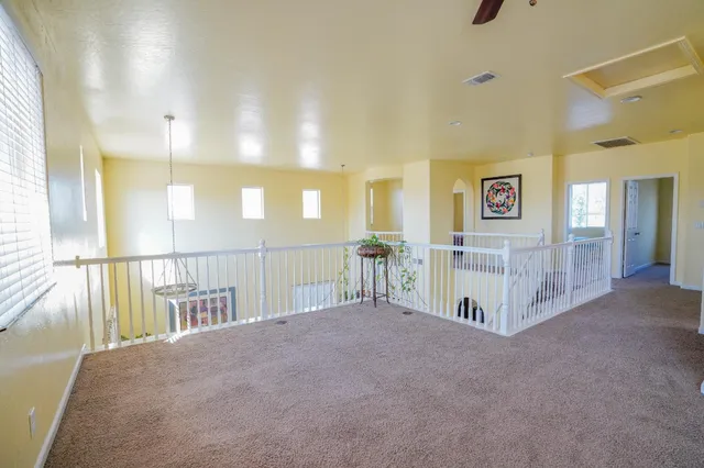 a view of a hallway with windows