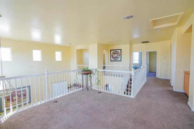 a view of a hallway with windows
