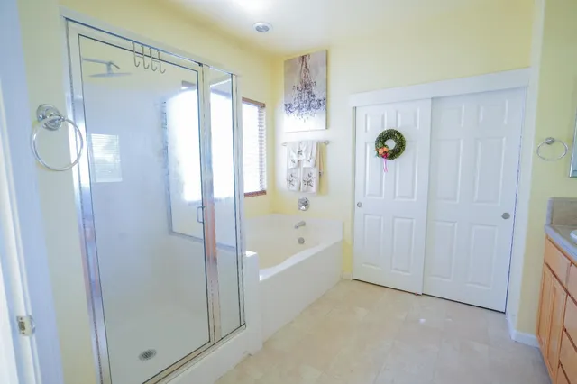a bathroom with a shower and a tub