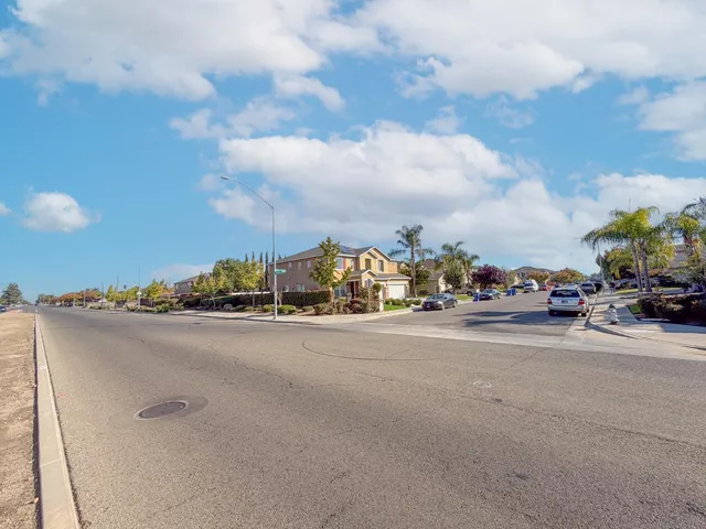 a view of a city street with cars